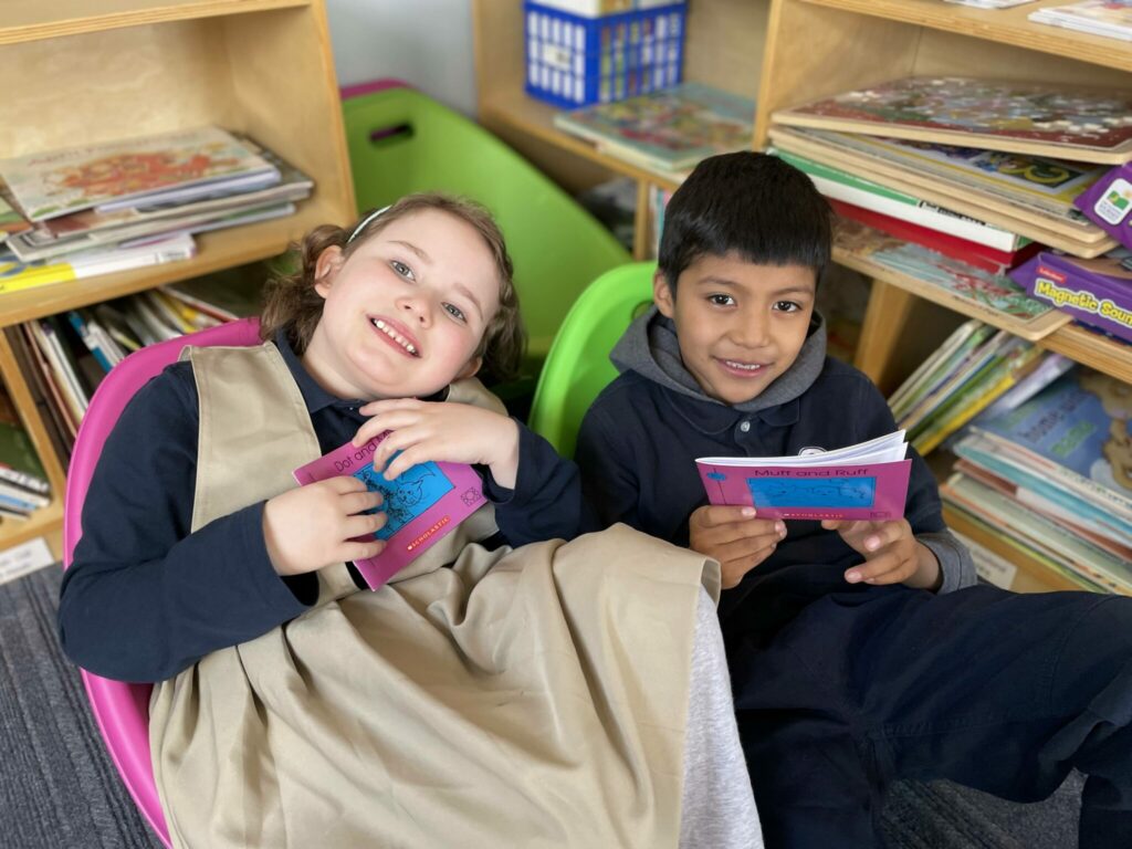 Two school children in a school library